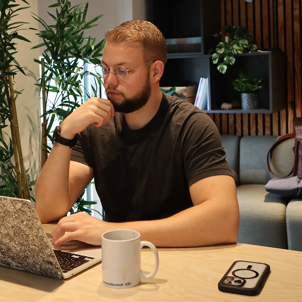 Rune working at desk with monitor